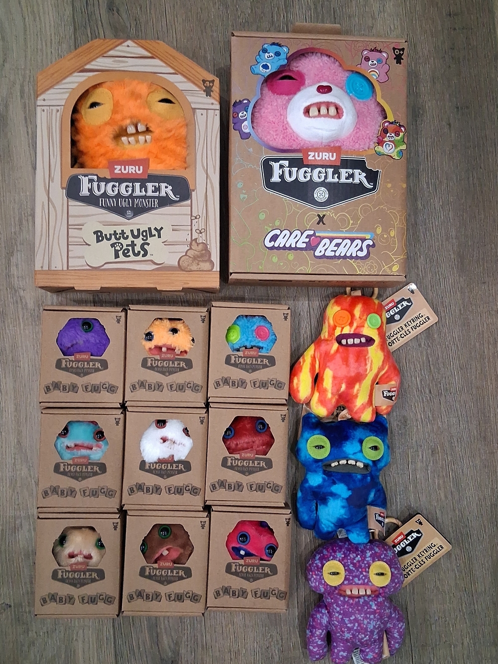 Zuru FUGGLER Lot 14 pieces Baby Fug Set, Cod Father, Care Bear, Porte-Cles Set